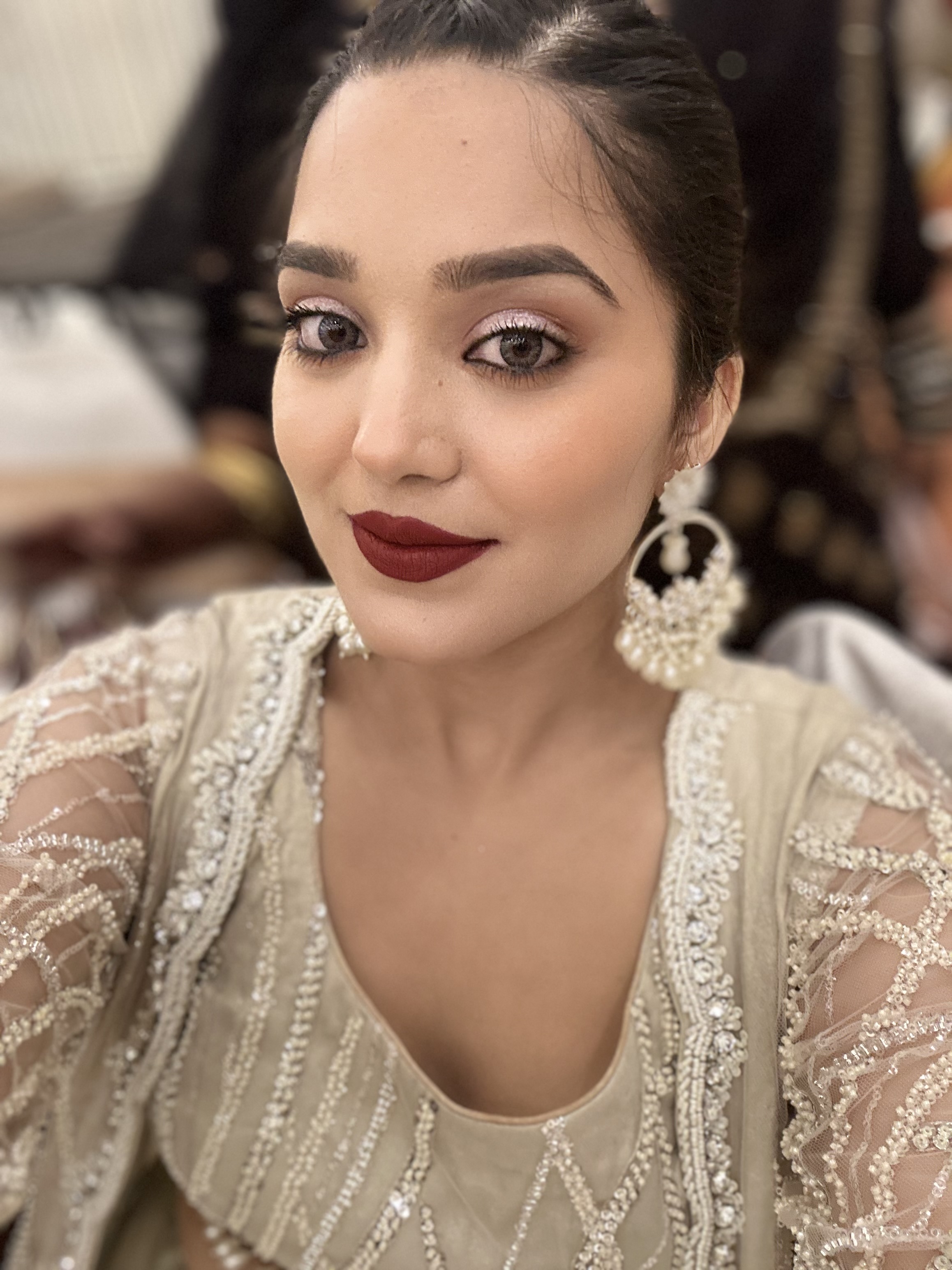 Glam party makeup with bold dark lip and smoky eye
