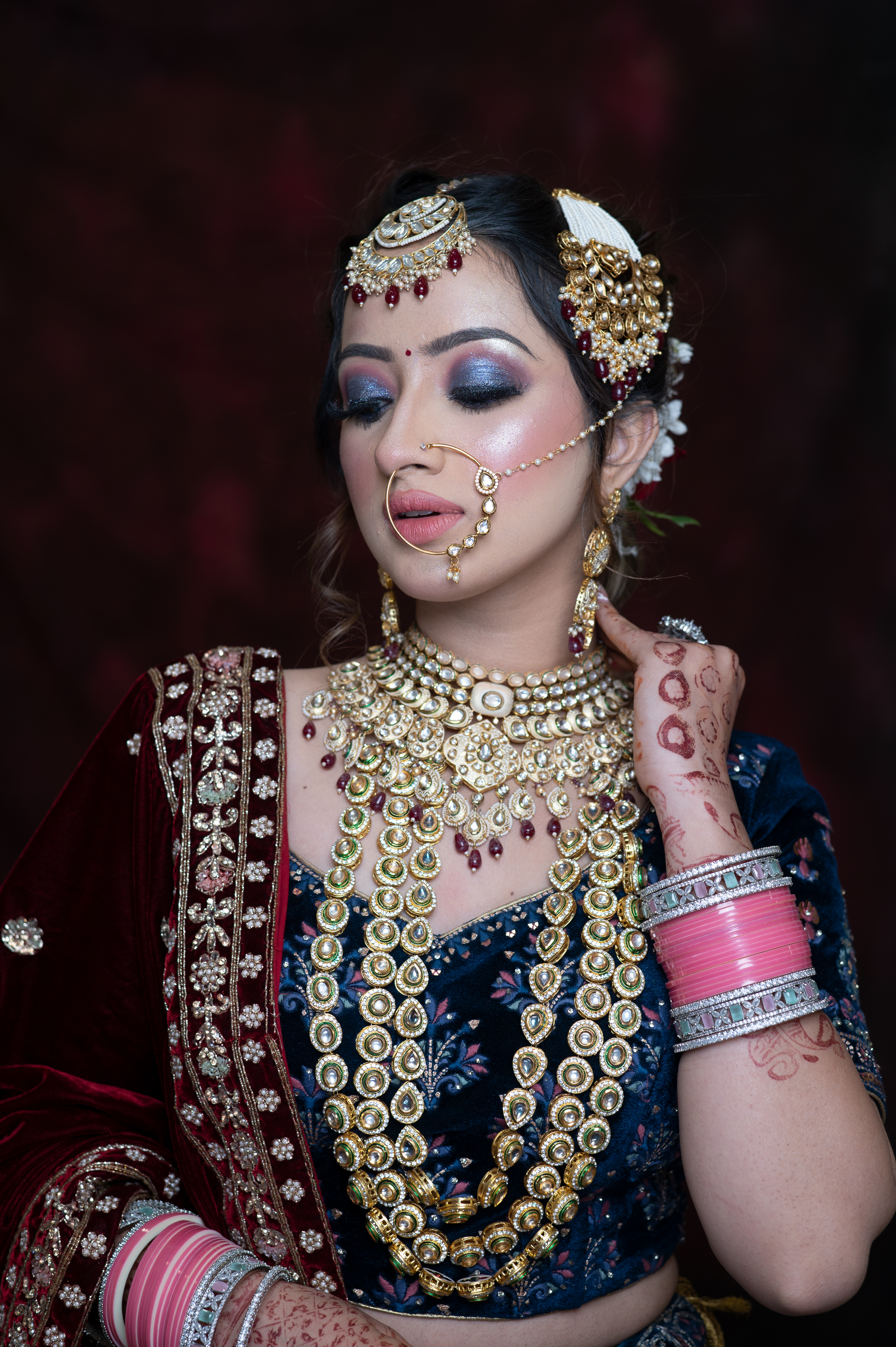 Asian bridal makeup with layered necklaces